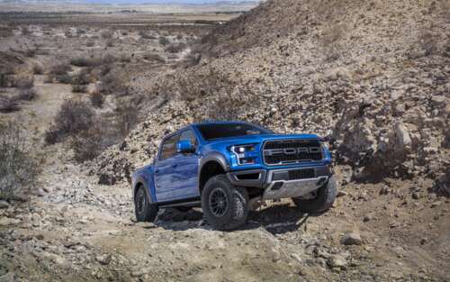 A detailed view of a Ford F-150 Raptor, a high-performance off-road pickup truck.