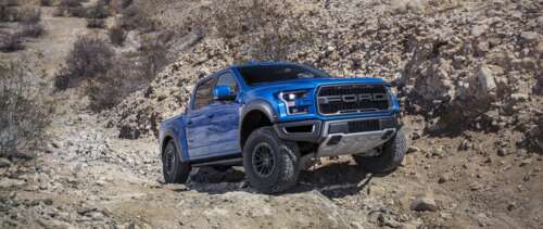 A detailed view of a Ford F-150 Raptor, a high-performance off-road pickup truck. UWUHD free background images