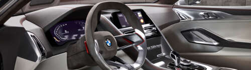 Detailed view of the high-tech dashboard and premium interior components of the BMW... Dual UHD wallpaper for laptop download