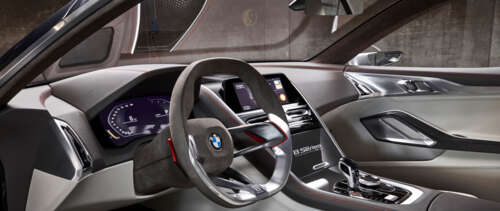 Detailed view of the high-tech dashboard and premium interior components of the BMW... UWUHD free desktop wallpaper