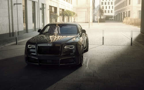 A premium black Rolls-Royce Wraith luxury vehicle featuring a deep glossy finish. 7680x4800