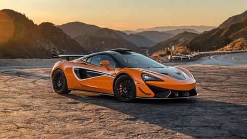A vibrant orange McLaren 620R supercar featuring sleek aerodynamic lines and a high-performance... 4K (Ultra HD) free desktop wallpaper