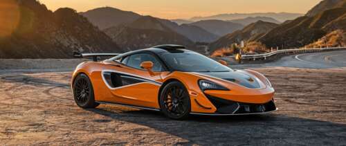 A vibrant orange McLaren 620R supercar featuring sleek aerodynamic lines and a high-performance... UWUHD ps4 wallpaper