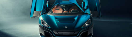 A sleek, high-performance Rimac Nevera electric hypercar displaying aerodynamic design. high definition wallpaper