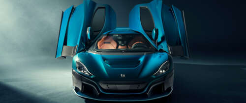 A sleek, high-performance Rimac Nevera electric hypercar displaying aerodynamic design. UWUHD wallpaper for laptop download