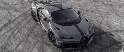 A polished silver Bugatti Chiron Pur Sport hypercar displaying its aerodynamic bodywork. UWUHD wallpaper photo gallery download