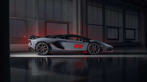 A sleek, metallic silver Lamborghini Aventador SVJ supercar showcasing its aerodynamic... 8K background images hd