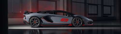 A sleek, metallic silver Lamborghini Aventador SVJ supercar showcasing its aerodynamic... Dual UHD ps4 wallpaper