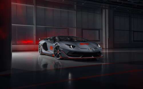A sleek and powerful silver Lamborghini Aventador SVJ supercar showcasing its aerodynamic... 7680x4800 free wallpaper for computer