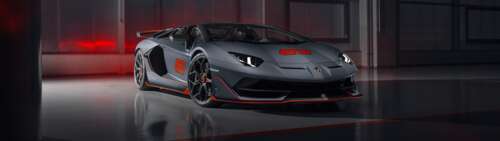 A sleek and powerful silver Lamborghini Aventador SVJ supercar showcasing its aerodynamic... Dual UHD wallpaper