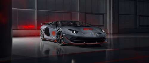 A sleek and powerful silver Lamborghini Aventador SVJ supercar showcasing its aerodynamic... UWUHD background images hd
