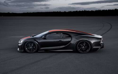 A close-up shot of a black Bugatti Chiron supercar with a glossy finish.