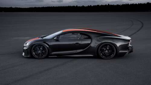A close-up shot of a black Bugatti Chiron supercar with a glossy finish.