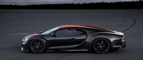 A close-up shot of a black Bugatti Chiron supercar with a glossy finish.
