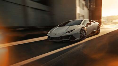A sleek silver Lamborghini Huracan Evo supercar showcasing its aerodynamic design... 4K (Ultra HD) free hd wallpapers