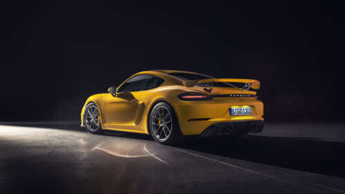 A vibrant yellow Porsche 718 Cayman sports car. 4K (Ultra HD) free desktop wallpaper