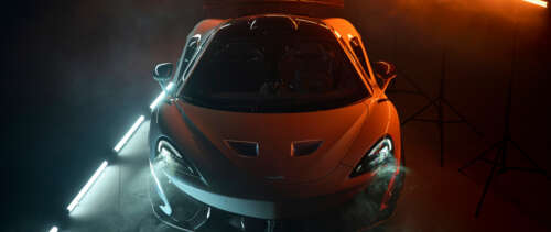 A high-performance McLaren 620R supercar in a bright orange finish, showcasing its... UWUHD computer backgrounds