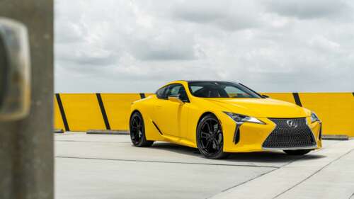 A sleek and vibrant yellow Lexus LC 500 supercar featuring aerodynamic luxury styling. 4K (Ultra HD) free wallpaper for computer