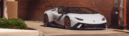 A high-performance white Lamborghini Huracan Performante supercar. Dual UHD computer backgrounds