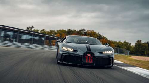 A close-up view of a Bugatti Chiron Pur Sport, featuring its sleek aerodynamic body... 4K (Ultra HD) high definition wallpaper