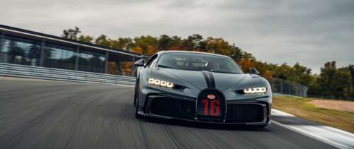A close-up view of a Bugatti Chiron Pur Sport, featuring its sleek aerodynamic body... UWUHD high definition wallpaper