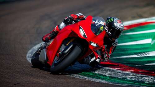 A 2024 Ducati Panigale V4 S racing motorcycle on a professional race track. wallpaper images