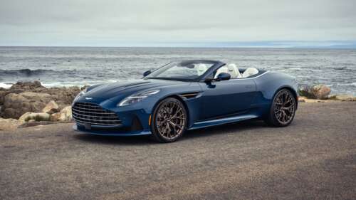 A sleek and polished 2025 Aston Martin DB12 luxury sports car in high detail. wallpaper