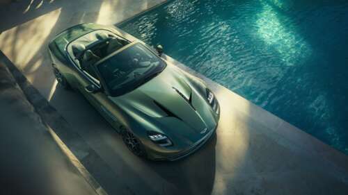 A cinematic, high-resolution close-up of the 2025 Aston Martin Vanquish Volante luxury... wallpaper