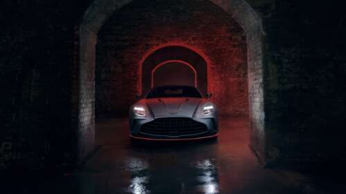 A sleek 2025 Aston Martin Vantage S positioned against a dark, moody background,... ps4 wallpaper