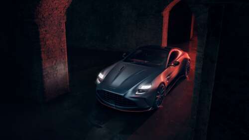 A sleek 2025 Aston Martin Vantage S featured in a dark, cinematic atmosphere with... free wallpaper