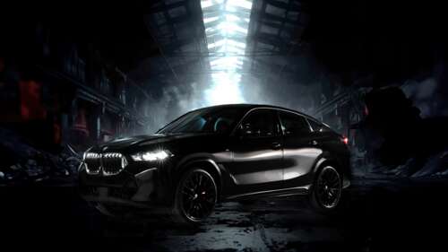A professional high-detail shot of the 2025 BMW X6 luxury SUV featuring sleek metallic... wallpaper