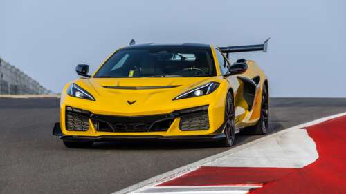 A high-performance 2025 Chevrolet Corvette ZR1 sports car driving on a professional... wallpaper