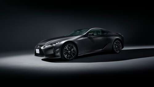 A high-resolution, close-up shot of a modern 2025 luxury coupe with a sleek design...
