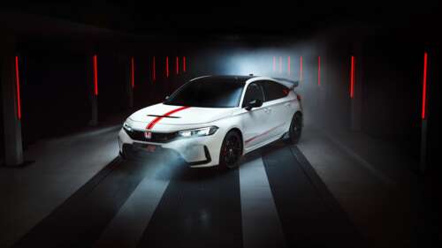 A high-detail, ultra-HD shot of a 2025 Honda Civic Type R parked in a dark, atmospheric...