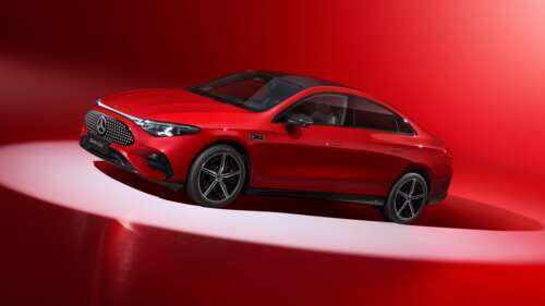 A high-resolution shot of a red 2025 Mercedes-Benz CLA 300 L against a vibrant red... high definition wallpaper