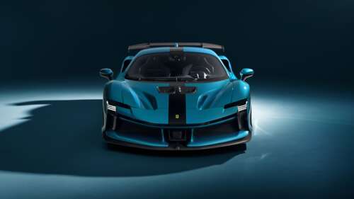 A high-resolution view of a blue Novitec Ferrari SF90 XX Stradale supercar with a... wallpaper download