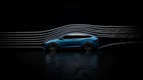 A 2025 Tesla Model X Plaid electric SUV presented in a dark, minimalist setting. free wallpaper