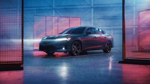 A sleek 2026 Acura Integra A-Spec sports sedan featuring modern aerodynamic lines... free wallpaper