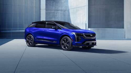 A sleek and aerodynamic high-performance electric vehicle with futuristic metallic... free background