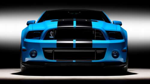 Front view of a powerful muscle car featuring iconic racing stripes and an aggressive... 4K (Ultra HD) free background