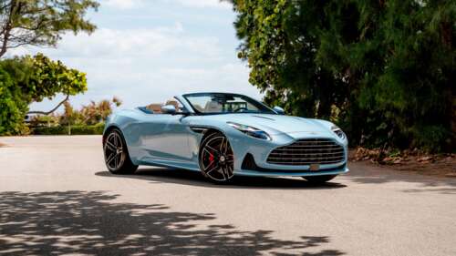 A high-detail 5K render of the Aston Martin DB12 luxury sports car featuring sleek... free hd wallpapers