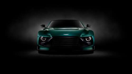 A high-resolution, cinematic shot of an Aston Martin Valorem sports car against a... wallpaper