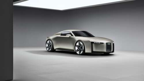 A sleek and futuristic Audi Concept C electric sports car featuring aerodynamic lines... wallpaper