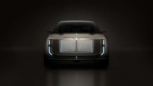 A sleek Bentley EXP 15 electric concept car showcased against a deep, dark, cinematic... free wallpaper