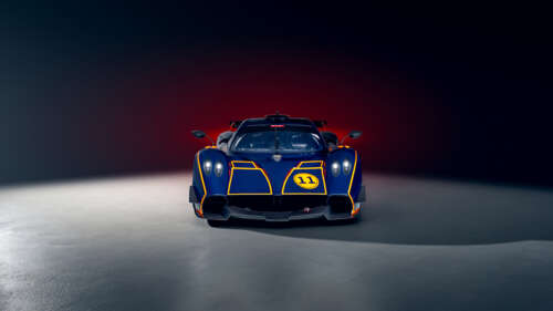 A sleek blue Pagani Huayra R supercar showcasing its aerodynamic body and powerful... wallpaper