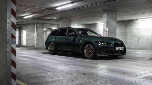A cinematic view of a dark green illuminated parking garage with a moody atmosphere. wallpaper