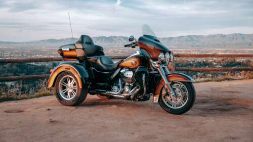 A detailed 8K close-up of a modern 2025 Harley-Davidson cruiser motorcycle free wallpaper
