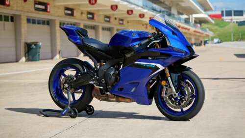 A high-tech 2025 sports bike with aerodynamic fairings and neon accents. ps4 wallpaper