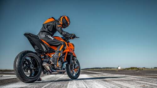 KTM 1390 Super Duke R 2024 naked motorcycle on a race track tarmac desktop wallpaper