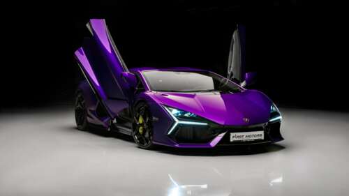 A high-detail, close-up view of a Lamborghini Revuelto supercar featuring a vibrant... free wallpaper